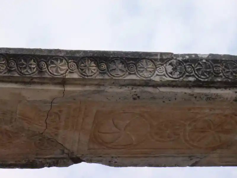 Stone ruins with solar symbols